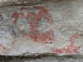 Red drawings on rock