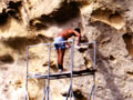 People working on rock face with scaffolding