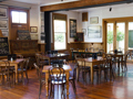 Chairs and tables and bar inside pub