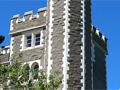 Twoer on corner of castle-like structure with time-ball at top