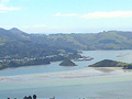 Large harbour surrounded by green hills