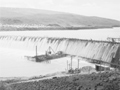 Water rushing over large dam