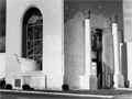 Cube-shaped concrete building with Wellington Provincial Centennial Memorial inscribed on front.