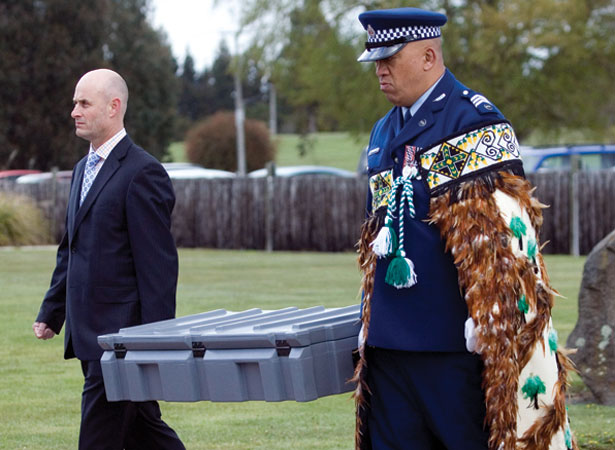 Police return the recovered medals to the National Army Museum