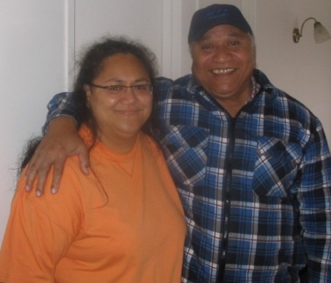 Woman with older man with arm around her shoulder