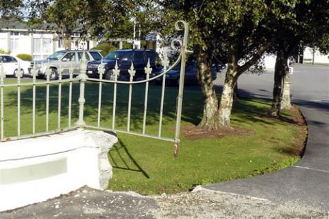 Detail showing where a memorial gate used to hang
