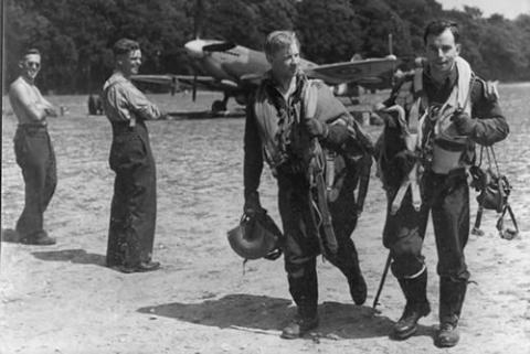 two pilots walking back from their aircraft