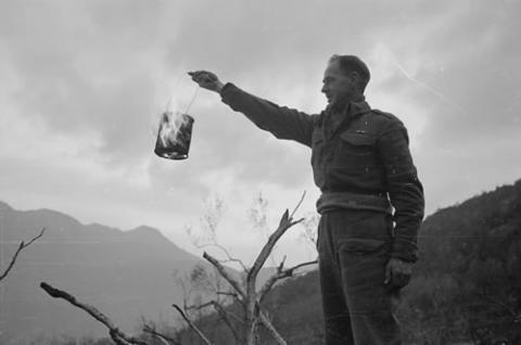 Soldier holding flaming brazier