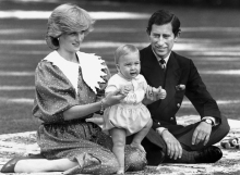 Lady ID and Prince Charles with baby William and buzzy bee on picnic blanket