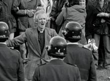 Reverend George Armstrong addresses police