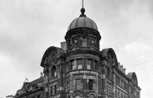 Art Nouveau styled corner building with 'Public Trust Office' sign