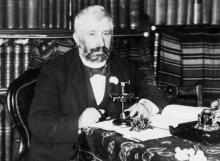Thomas Morland Hocken in his library, 1893