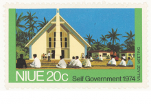 Niue 20c stamp with image of people seated in front of church and the words 'Village meeting' and 'Self Government 1974"