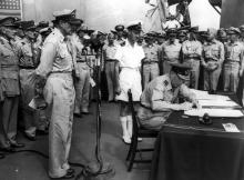 Isitt signing the Japanese surrender treaty on board the USS Missouri