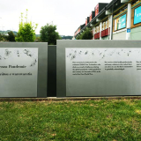 Steel plaque inscribed with text sitting on grass
