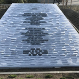 Granite tablet with words engraved on it