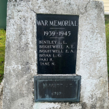 Stone obelisk with two inlaid plaques with list of names