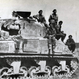 18 Battalion infantrymen on an M4 Sherman tank