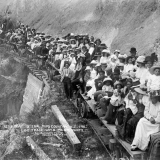 Logging train with picnic party, 1911