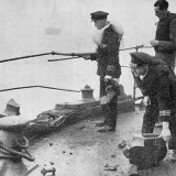Inspecting bomb damage on ship