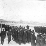 prisoners standing to attention in snow