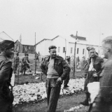 prisoners walking outside the wire