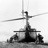 Infantry troops boarding a helicopter, c1970s