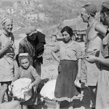 New Zealand soldiers talk to Italian refugees