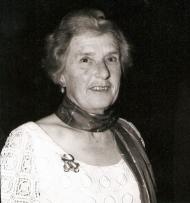 Black and white photo of middle-aged woman with a scarf