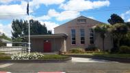 View of building with flagpole and flag outside
