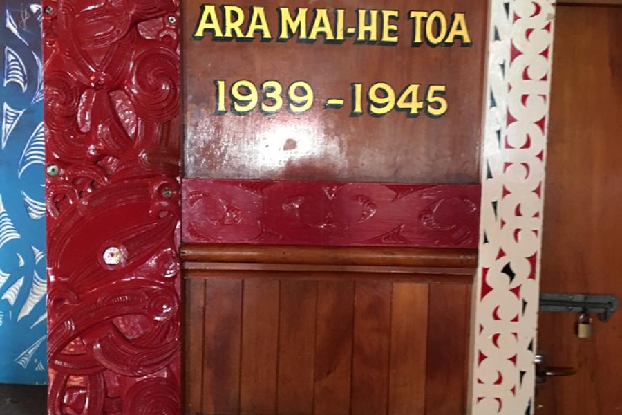 Wooden plaque with gold lettering in te reo Māori