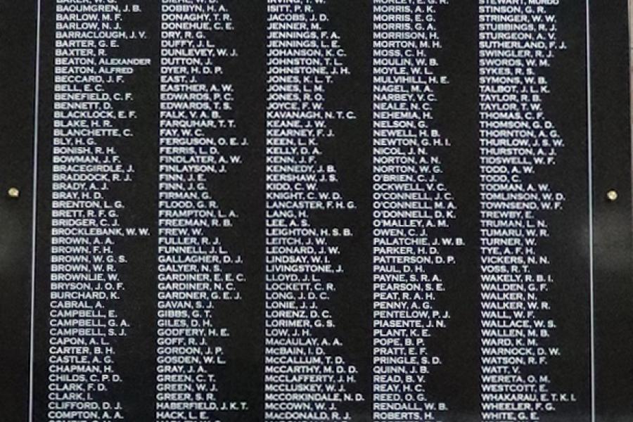 List of names in five columns in white on black marble plaque