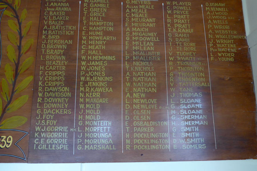 Detail of wooden plaque with list of names in gold lettering