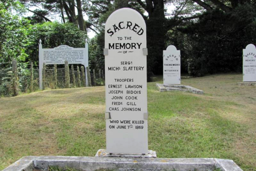 White grave headstone with black writing
