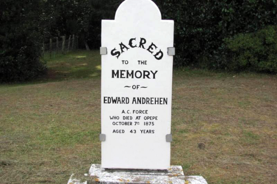 White grave headstone with black writing