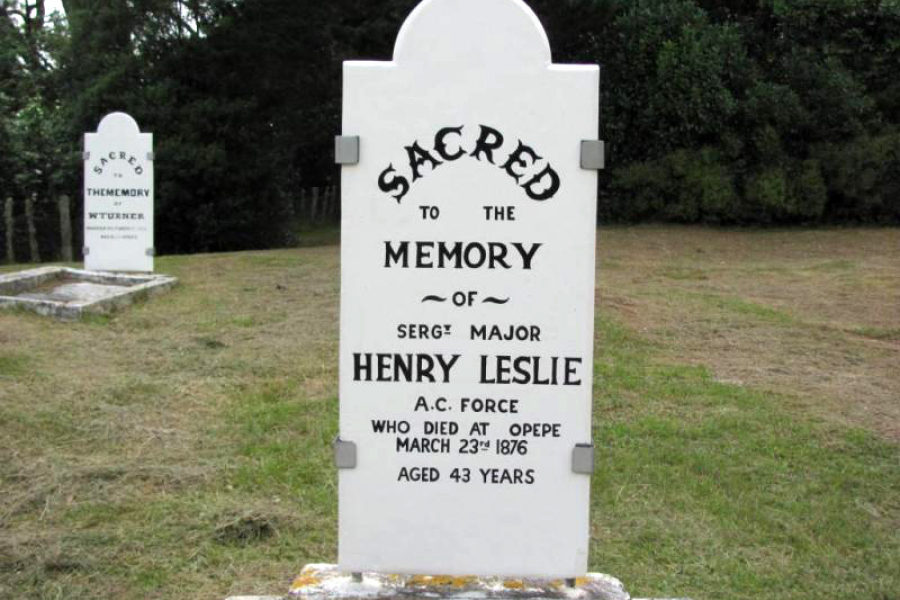 White grave headstone with black writing
