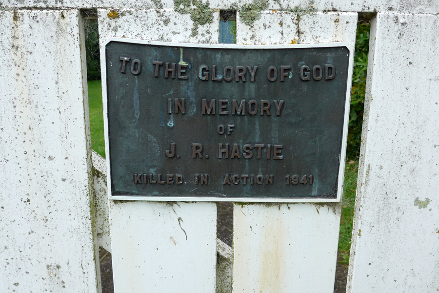 Plaque on a wooden fence