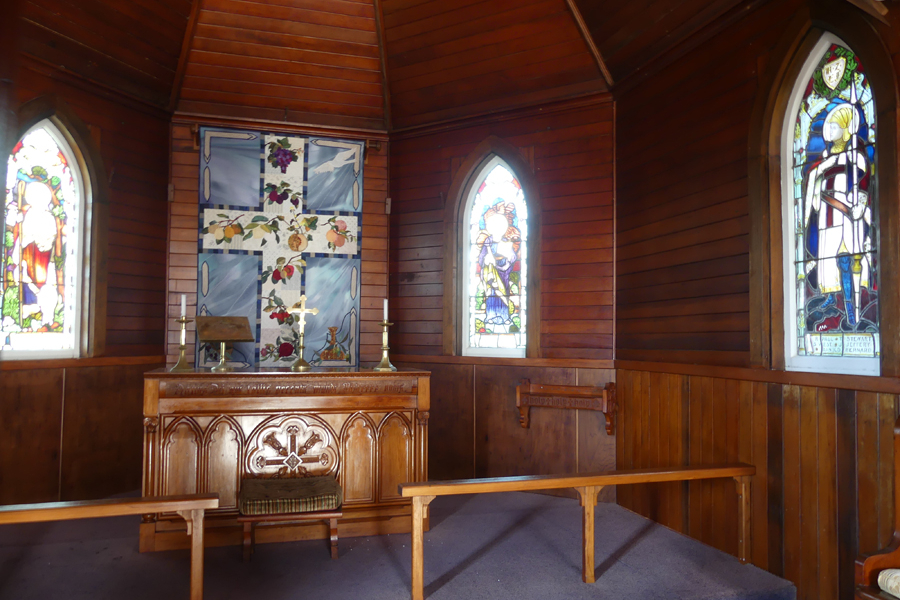 Interior of wooden church showing location of memorial windows