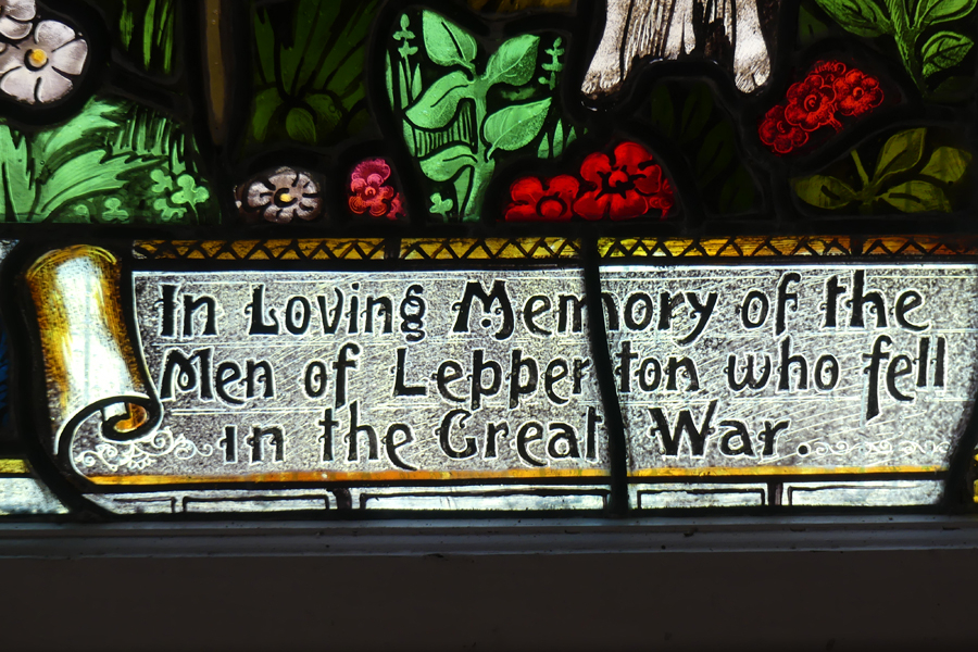 Memorial inscription on stained-glass window