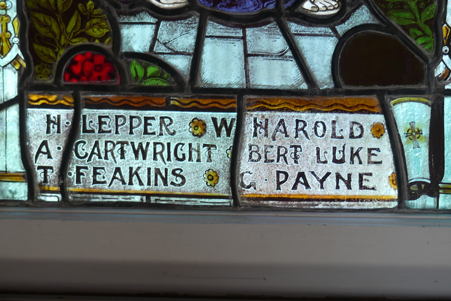 Memorial inscription on stained-glass window