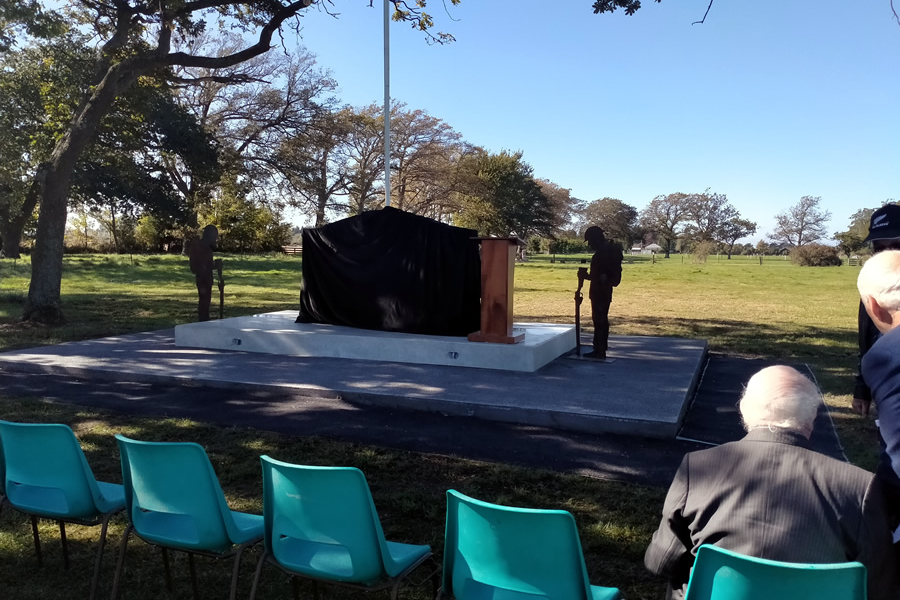Memorial under cover with row of seats in front