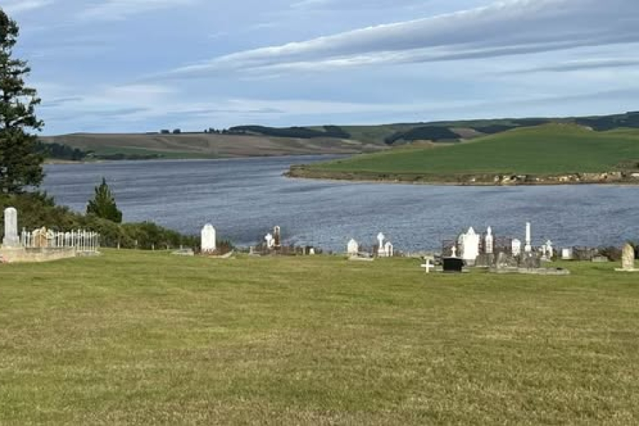 View from back of cemetery looking down on to lage