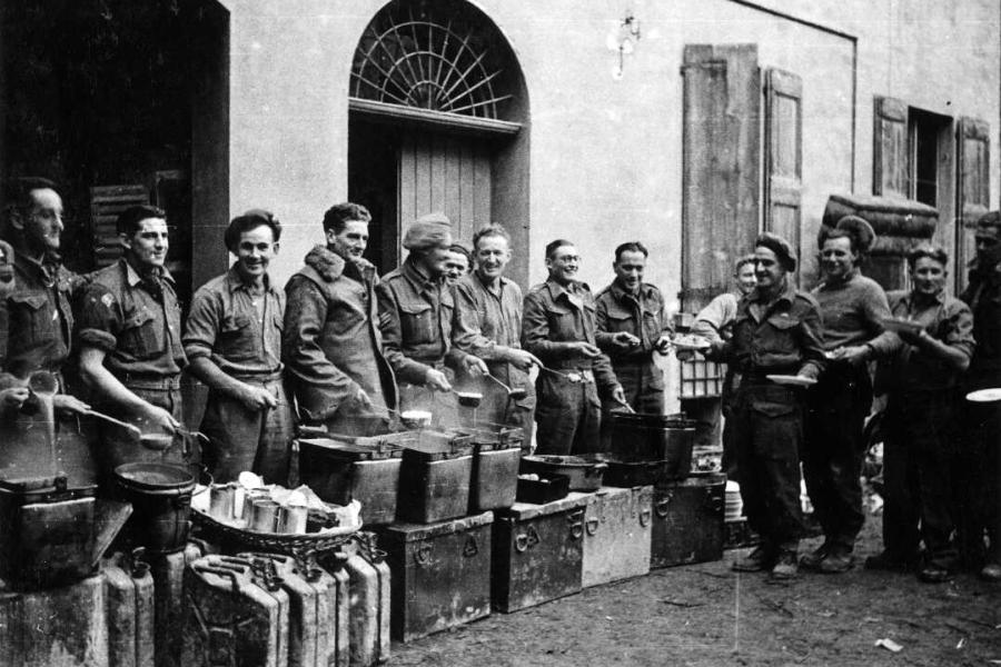 Soldiers of 21 Battalion serving Christmas dinner, Faenza, Italy, 1944.