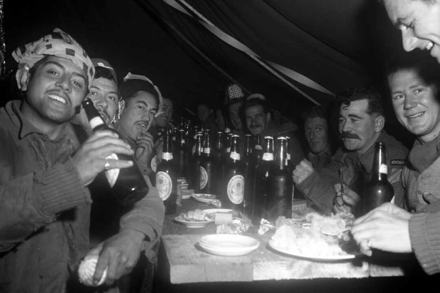 Happy New Zealand artillery gunners at the 163 Battery Christmas dinner, Korea, 1951.