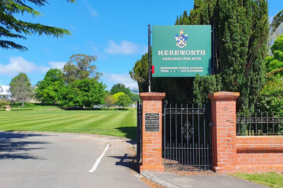 View of brick and wrought-iron gates at the entrance of Hereworth School grounds. Includes plaque to former pupil Walter Gisborne Heale who was killed at Gallipoli during the First World War.