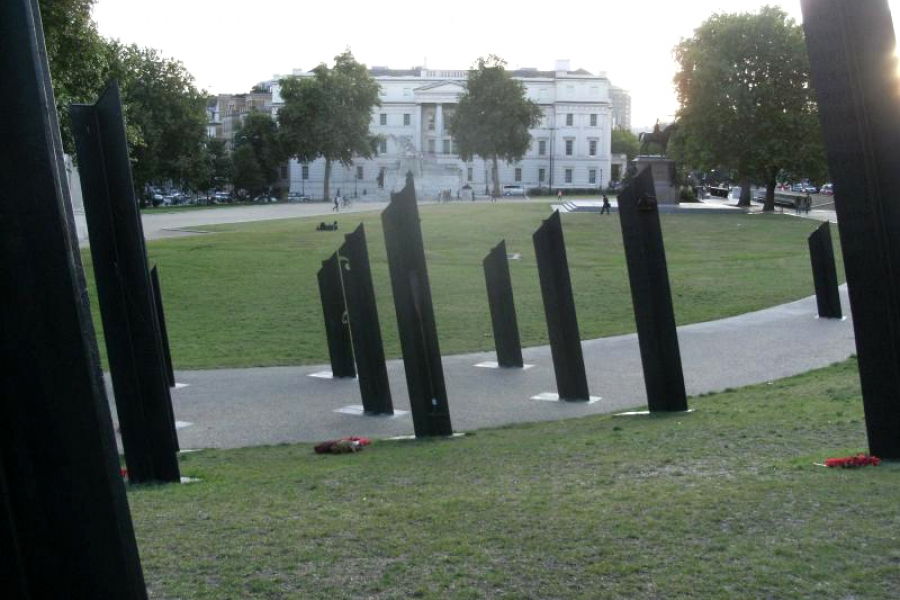 Group of bronze columns viewed from the rear