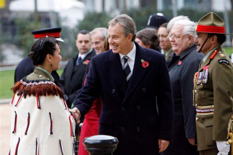 Group of men and women, some wearing military uniforms and medals