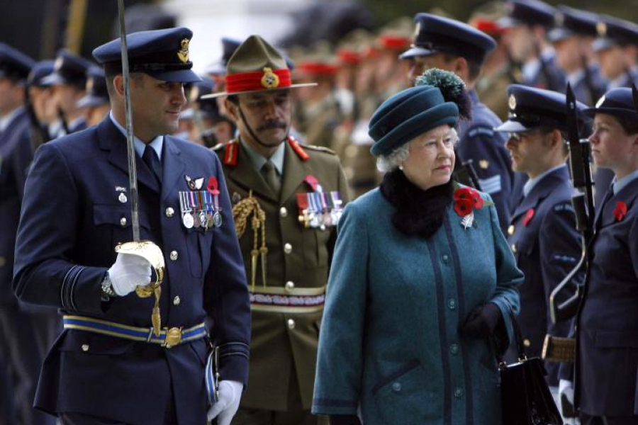 Group of men and women, some wearing military uniforms and medals