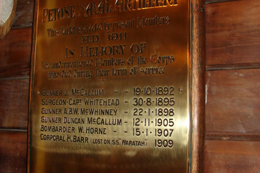 Brass memorial tablet on wall inside the church listing members of the Petone Naval Artillery who died during service