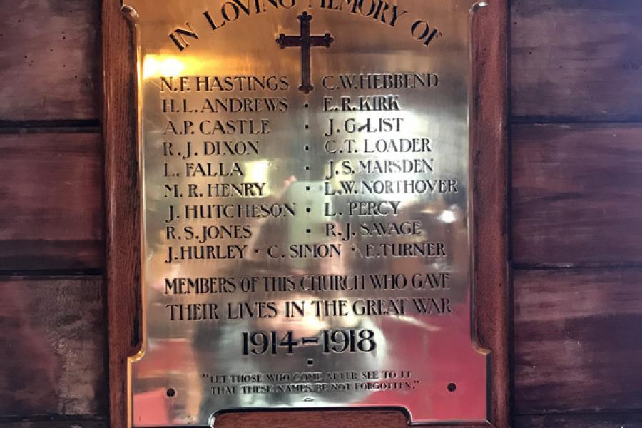 Brass memorial tablet on wall inside the church listing names of members of the St Augustine's Church who died during the First World War.